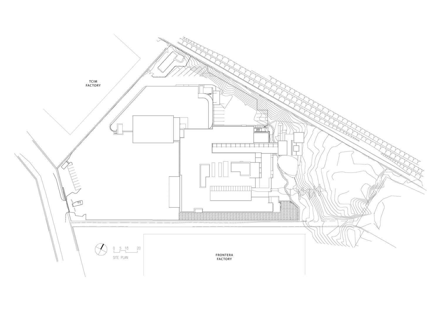Site plan - industrial factories flank the building so all views are oriented to the courtyards and the rocky outcrop at rear of site