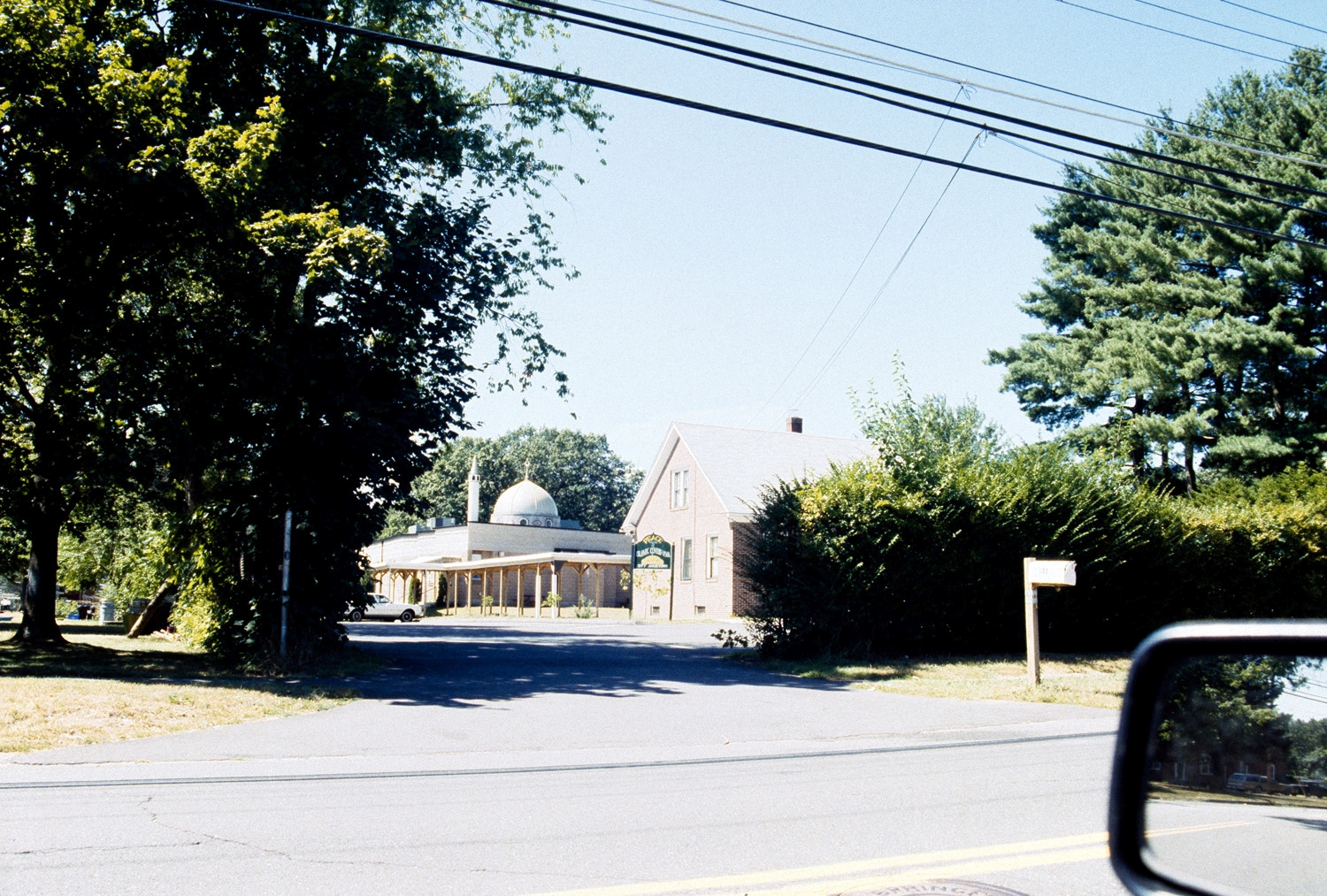 Islamic Society of Western Massachusetts - View from street, prior to expansion; the covered walkway and brick house are no longer extant