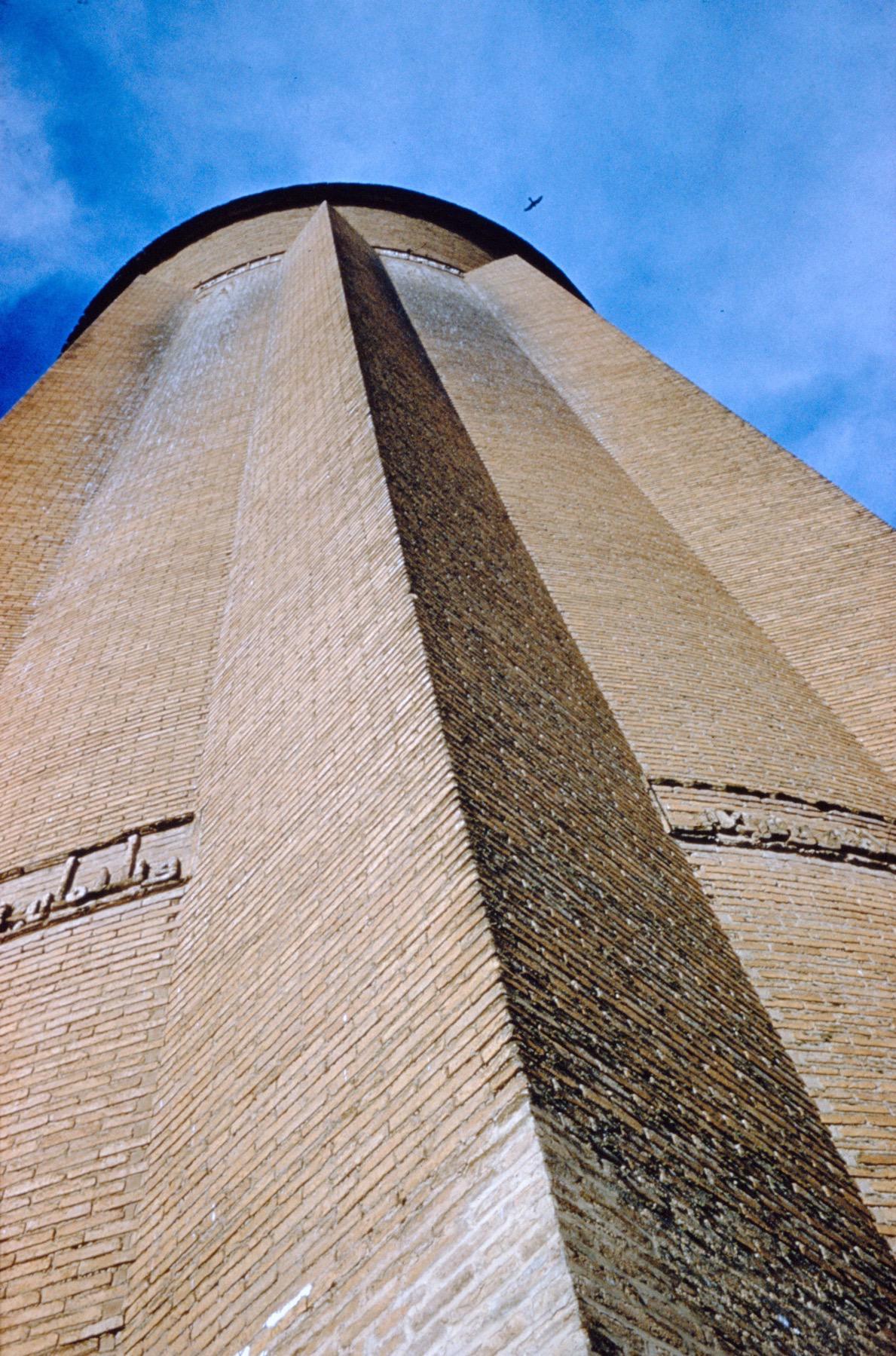 Exterior view looking up tower, showing exterior flanges with Kufic inscription
