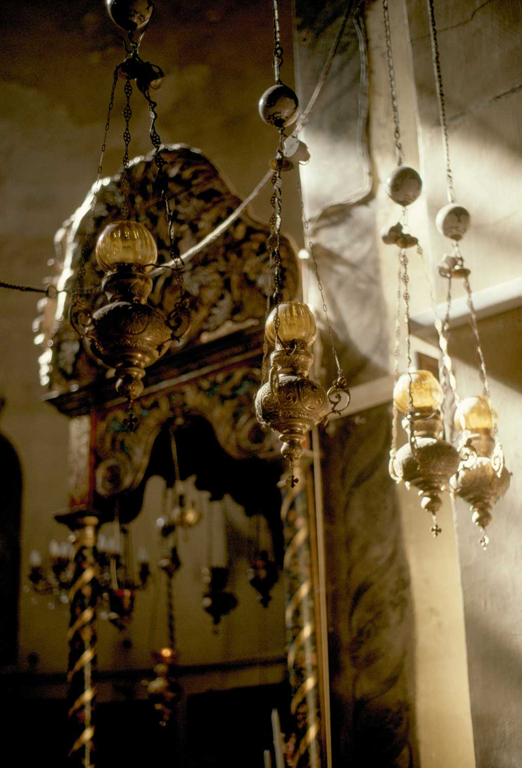 Church of the Nativity - Interior view, hanging lamps near Altar of the Virgin