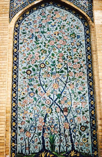 Exterior detail view showing tile panel with floral design