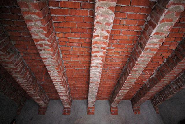 Flat brick roof and brick beams from below