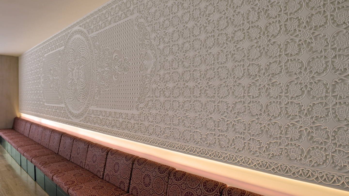 Ismaili Jamatkhana and Centre - <p>A carved plaster wall is the focal point of the multipurpose room</p>