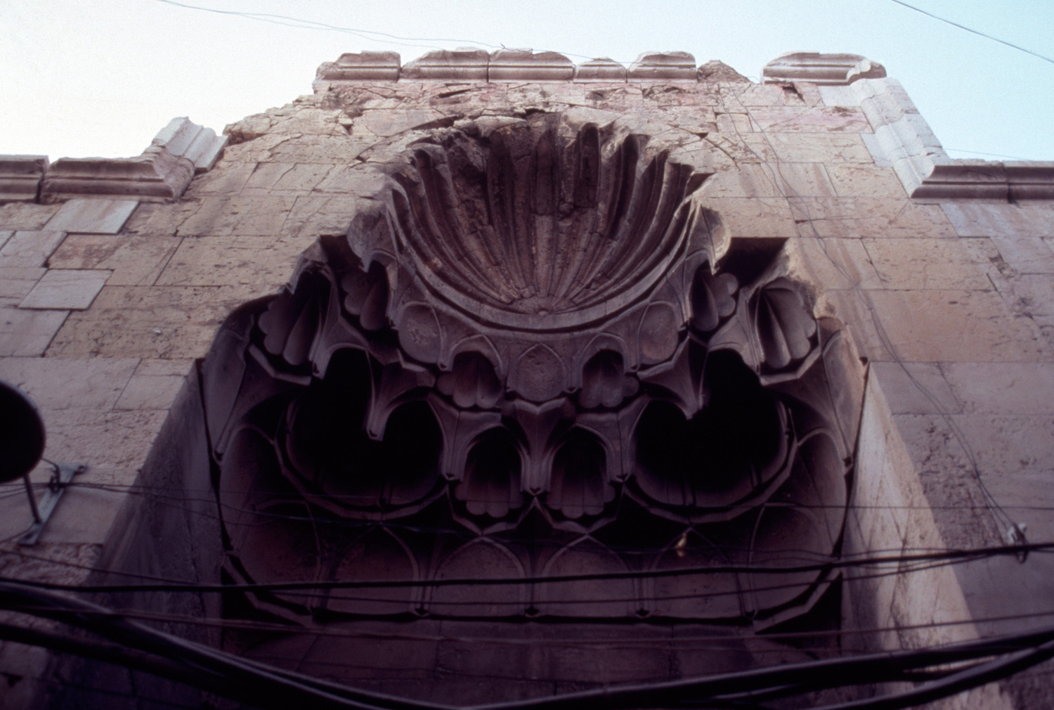 Muqarnas hood above portal