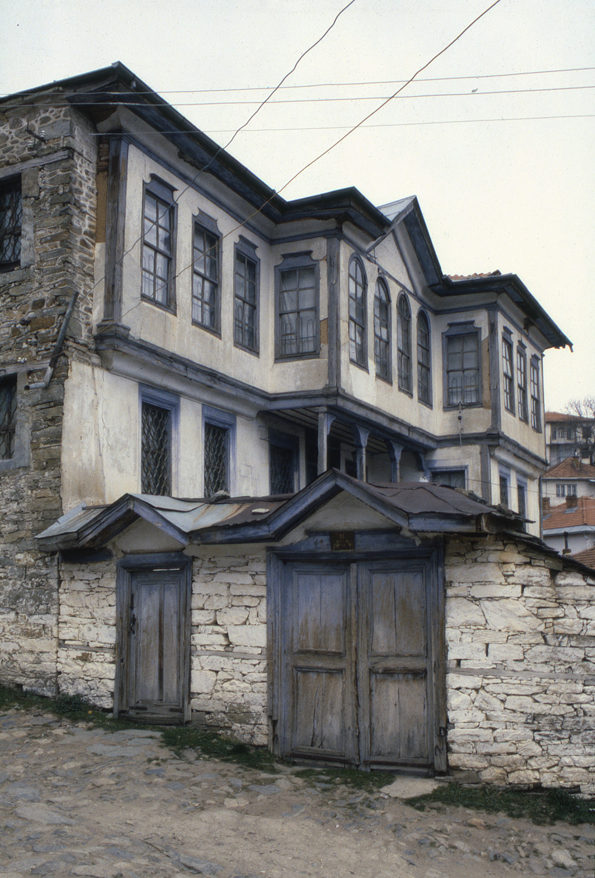 <p>This kuќa, also known as the Gurković House, is noted for its refined proportions and stepped facade. The ground level contains three storage rooms (ќevar) and an interior stair to the intermediate level. The intermediate level is reached by an exterior stair allowing one to enter a čardak with doorways to three living rooms (odaja) each with a fire place. The uppermost level is reached by an interior stair to its central čardak. This level has one large guest room (gostinska odaja) on the west side of the čardak and two other rooms on the east side.</p>