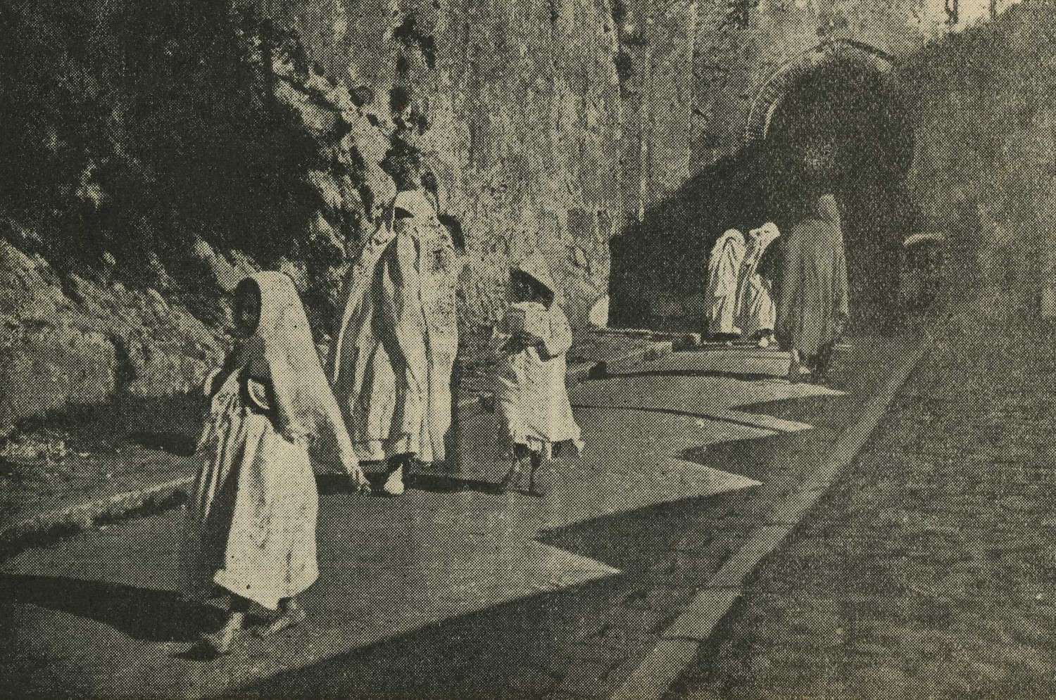 Women in traditional dress at Marshan Gate