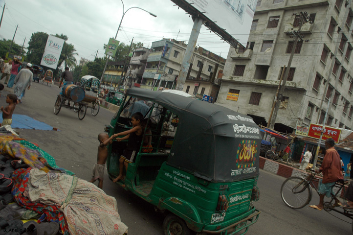 Street view with vendors and children in Chittagong on the road to Patanga.