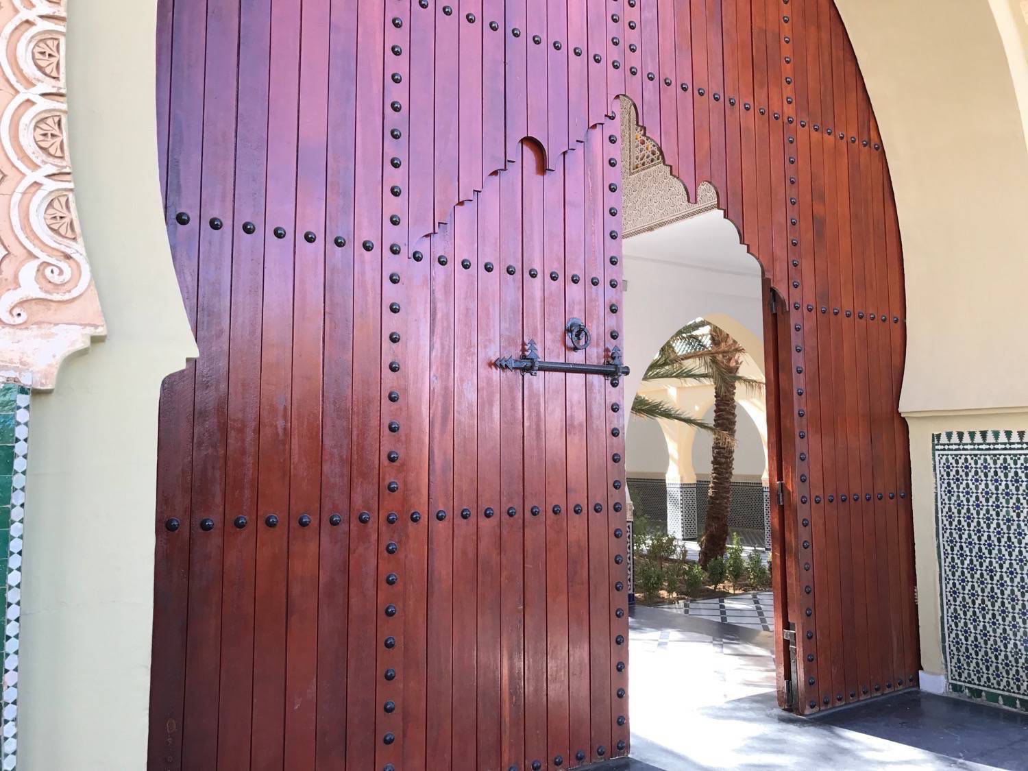 Close up of the main wooden gate leading to the Moulay Ali Cherif mausoleum complex