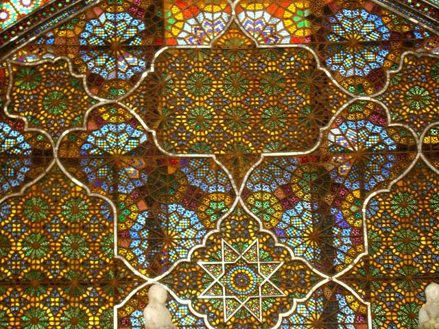 Detail view of talar in Imarat-i Takht-i Marmar, showing wooden lattice window with colored glass