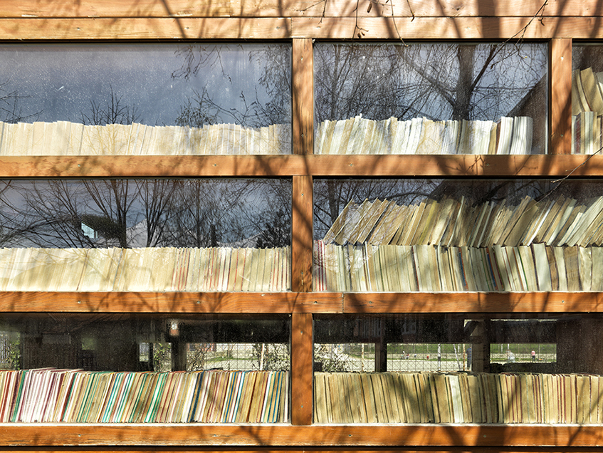 Bunateka in Lubinjë e Epërme village. Facade view showing the shelves and books through the glazed wall enabling a good natural exposure


