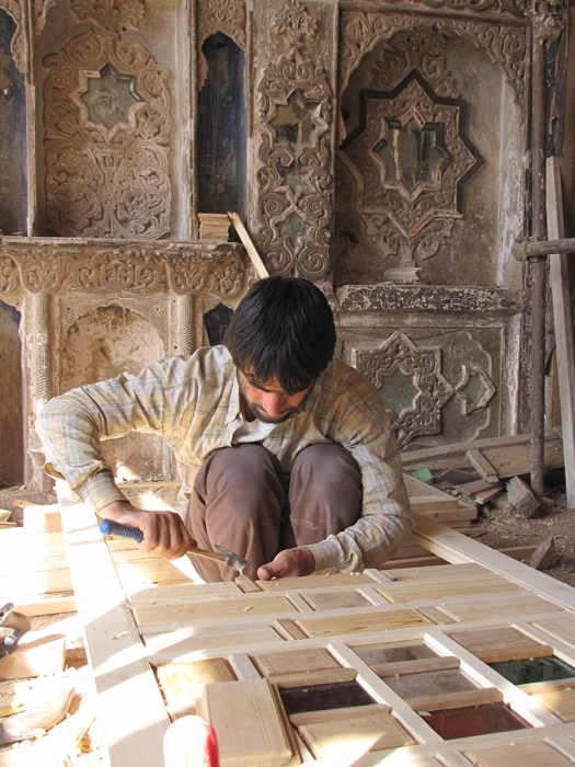 Posteen Doz House - Woodworker carving screens