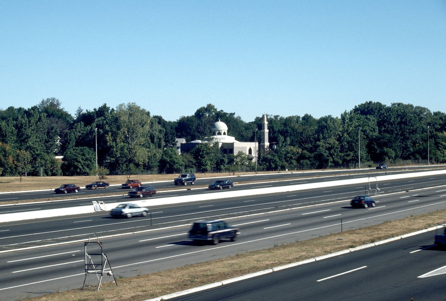 View looking west across the New Jersey Turnpike to Dar-ul-Islah, showing situation near highway