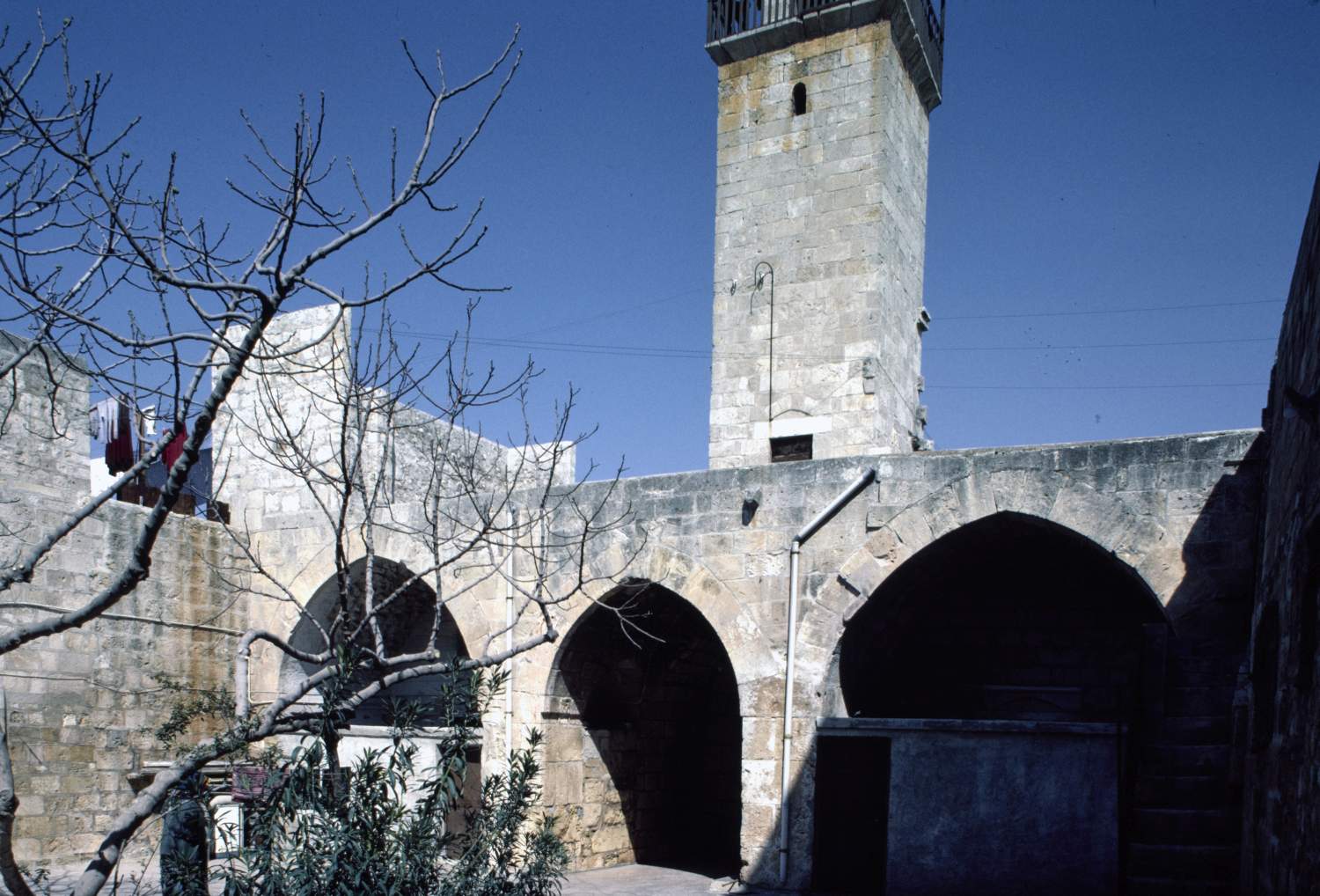 View of courtyard, facing minaret.