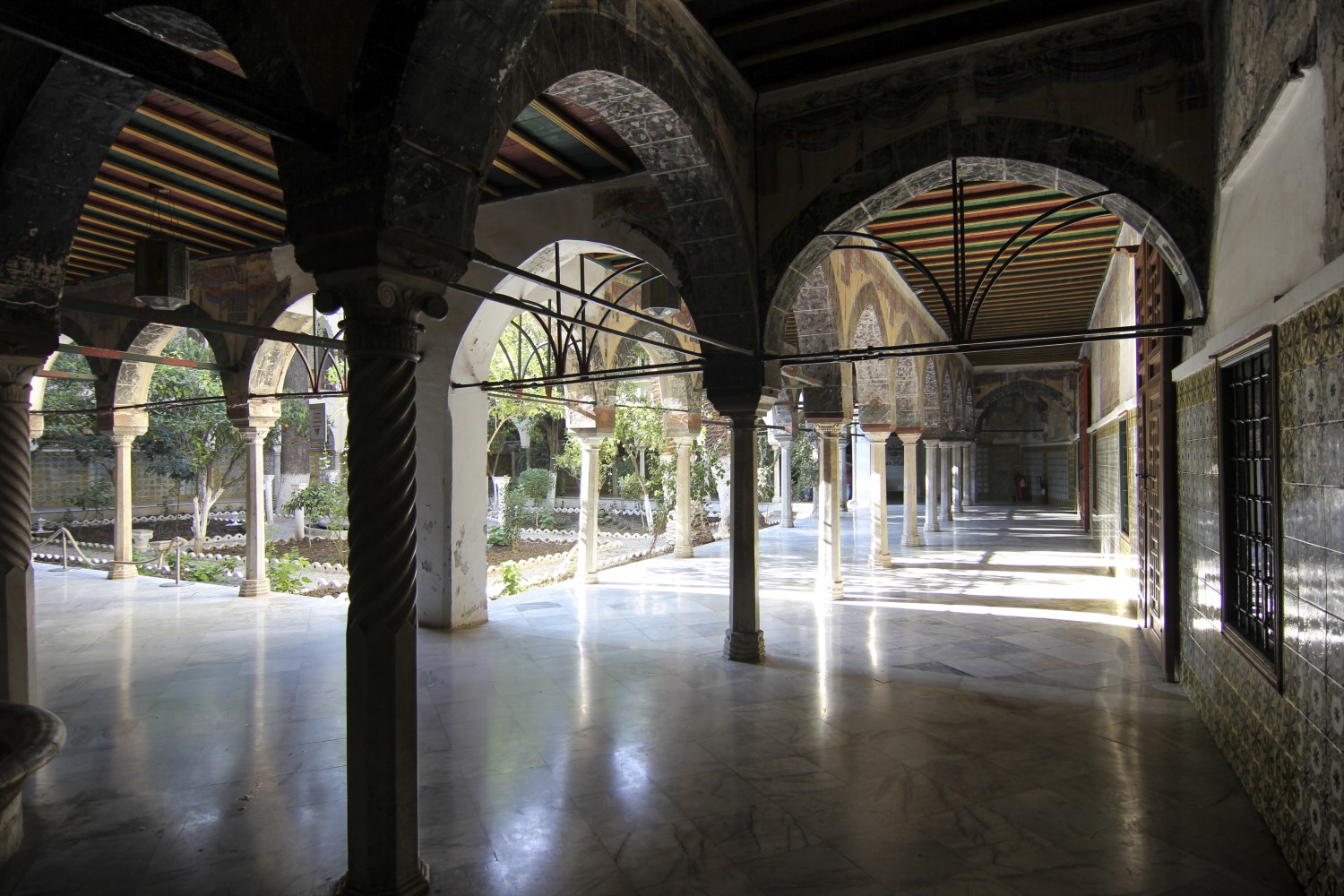 Orange trees garden, view of north and east galleries showing wreathed and octagonal columns, and frescos on the arches