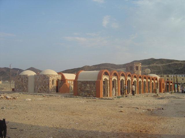 North view to the complex showing the handicraft shops and behind them the toilets building