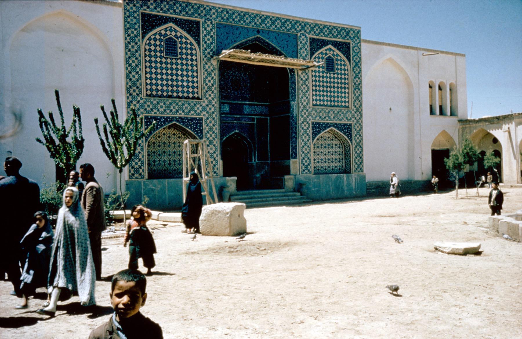 Southwest facade of northeast courtyard, view of central portal leading to madrasa before recent restorations.