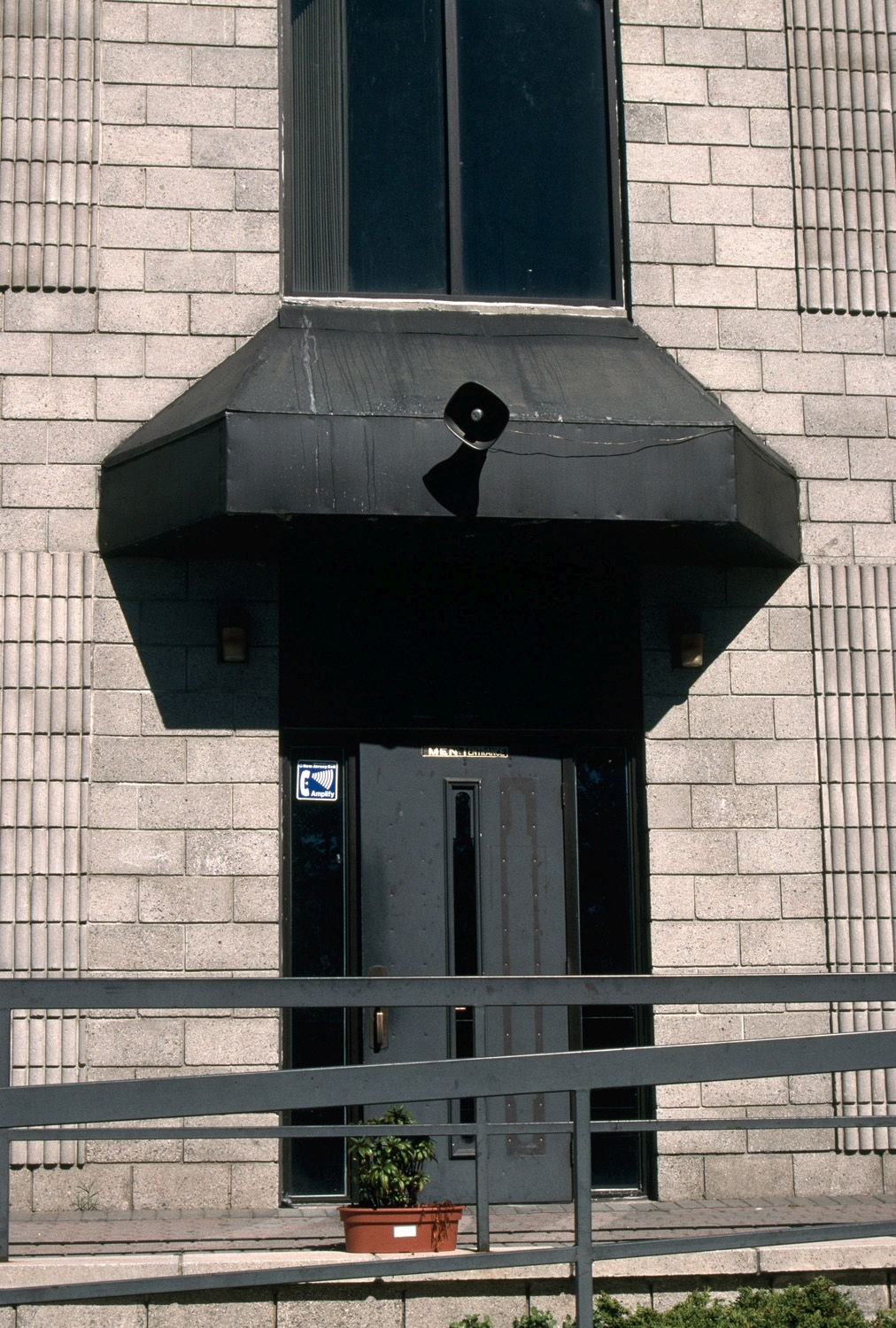 Exterior, detail of men's entrance