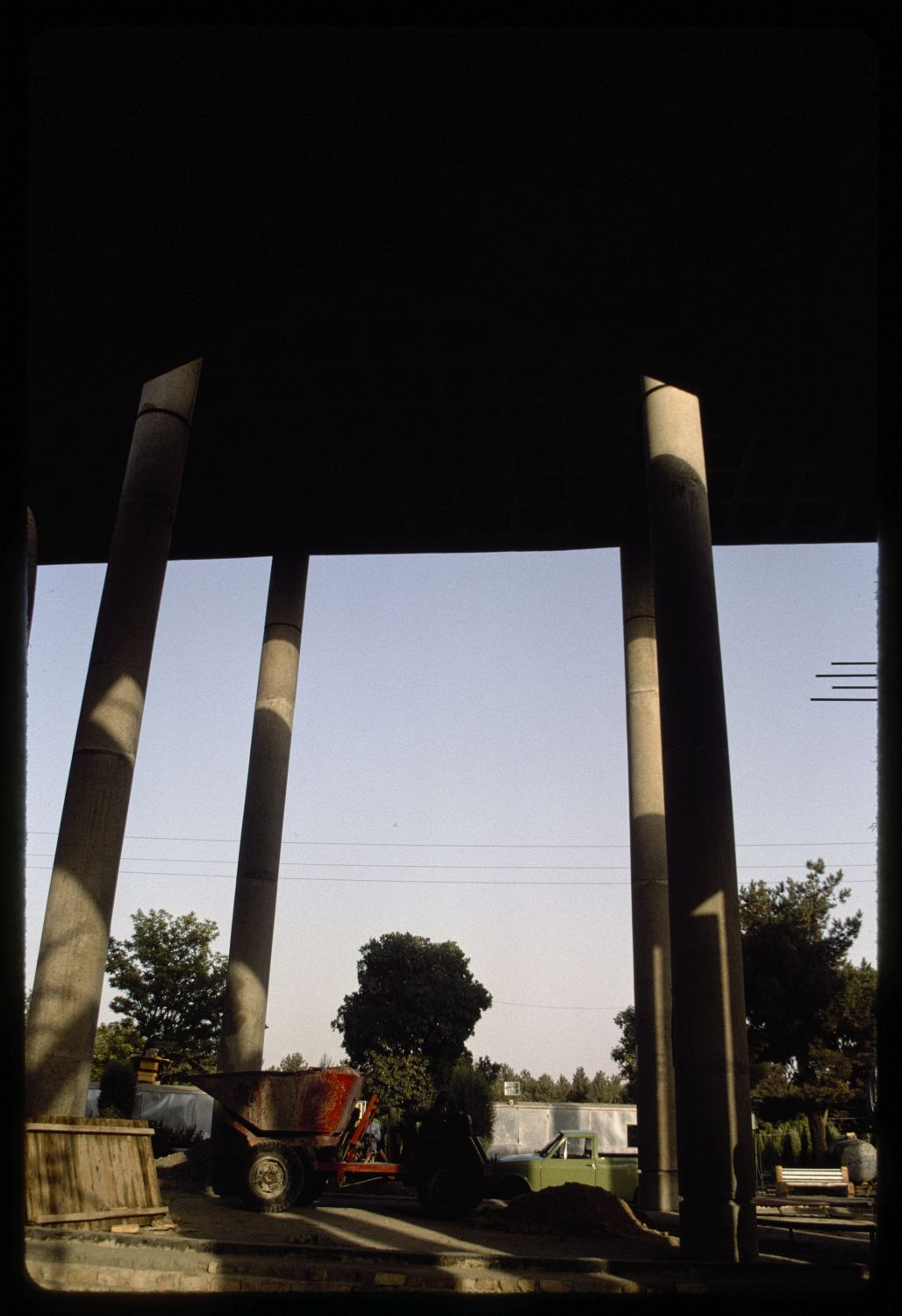 View of columns supporting roof under construction.