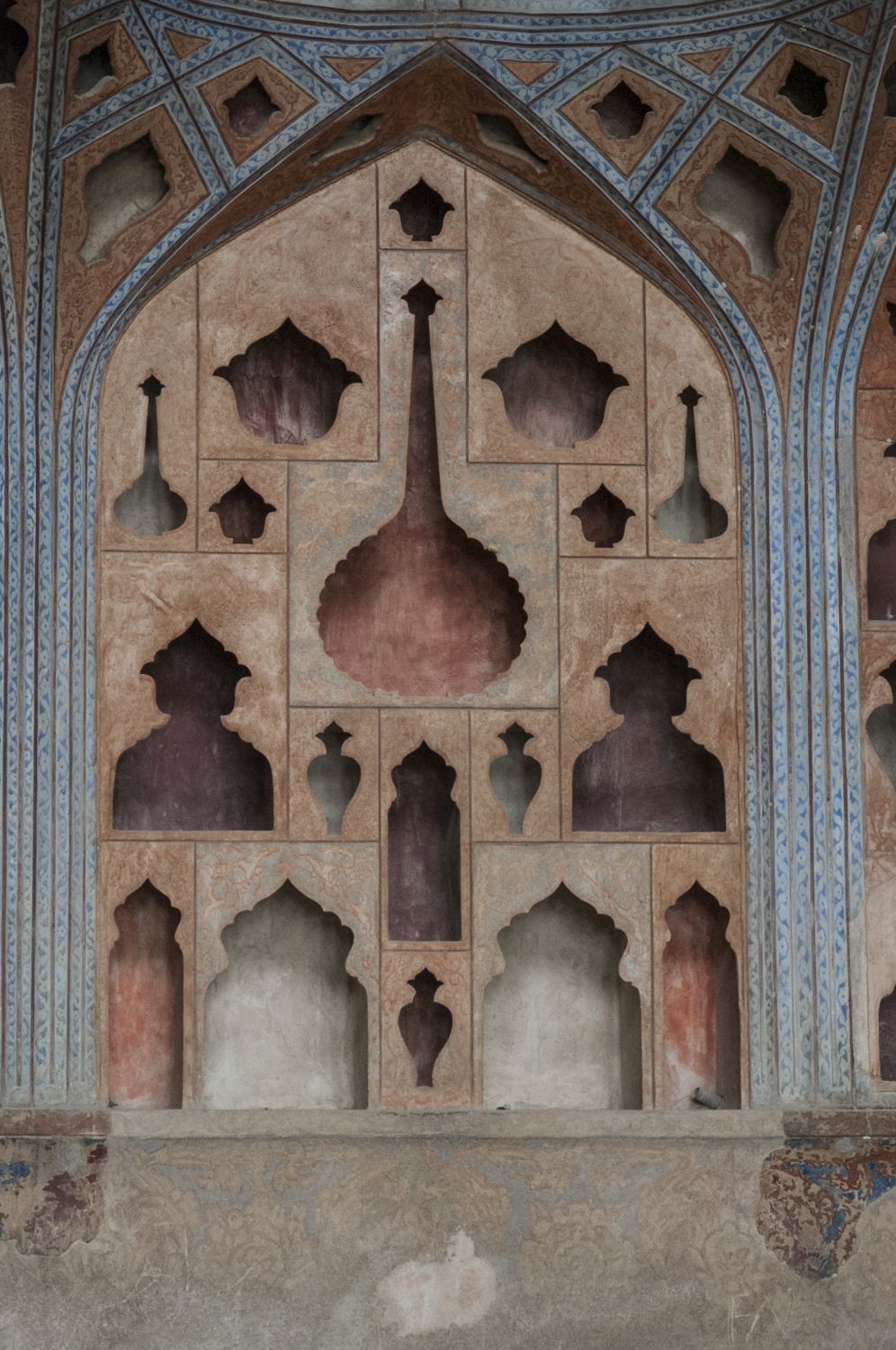 Fifth floor "music room," detail view of muqarnas vaults with perforations in shape of vessels and instruments.