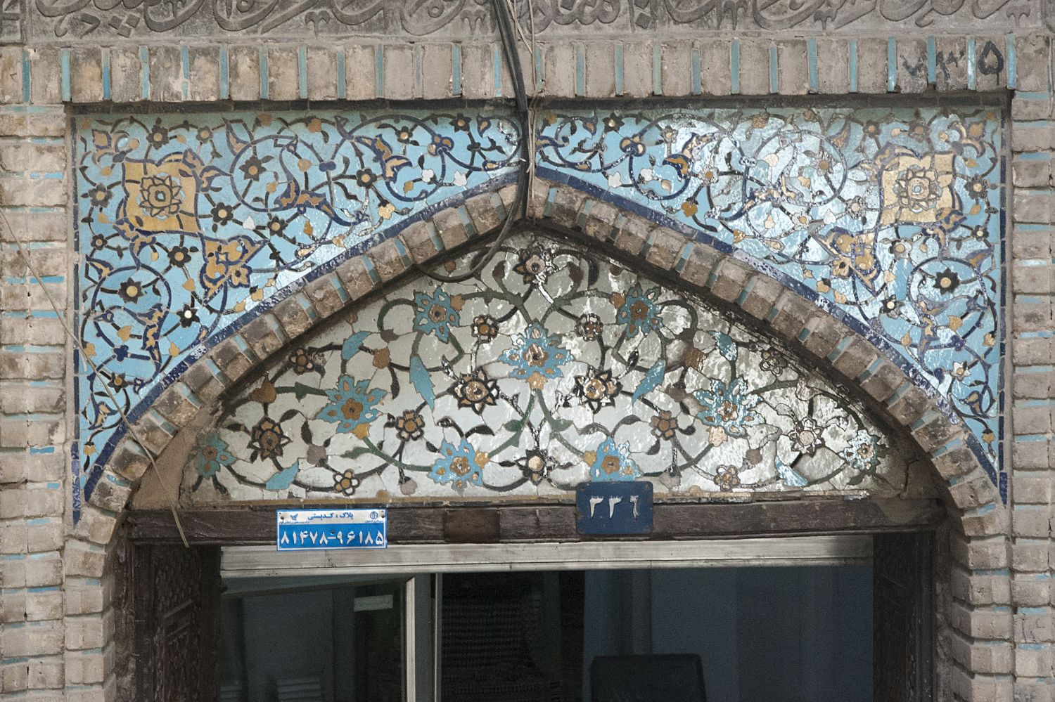 Entrance to Jarchi Mosque (Masjid-i Jarchi), view of tile-clad lunette over a doorway.