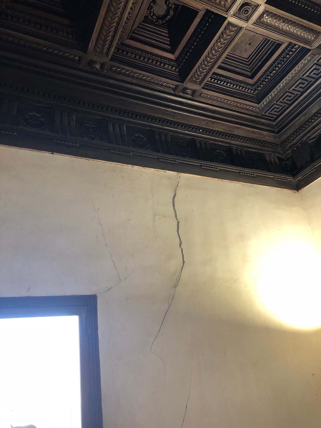 View of cracked plaster in a corner of the Emperor's Chambers