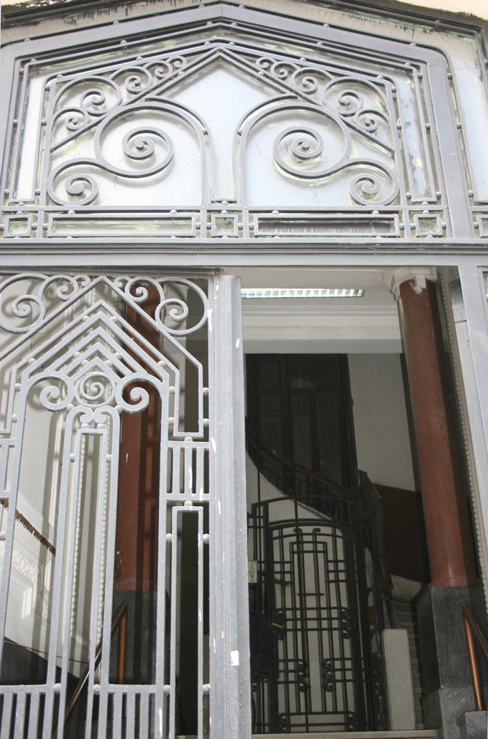 The ironwork entrance with pyramidal forms