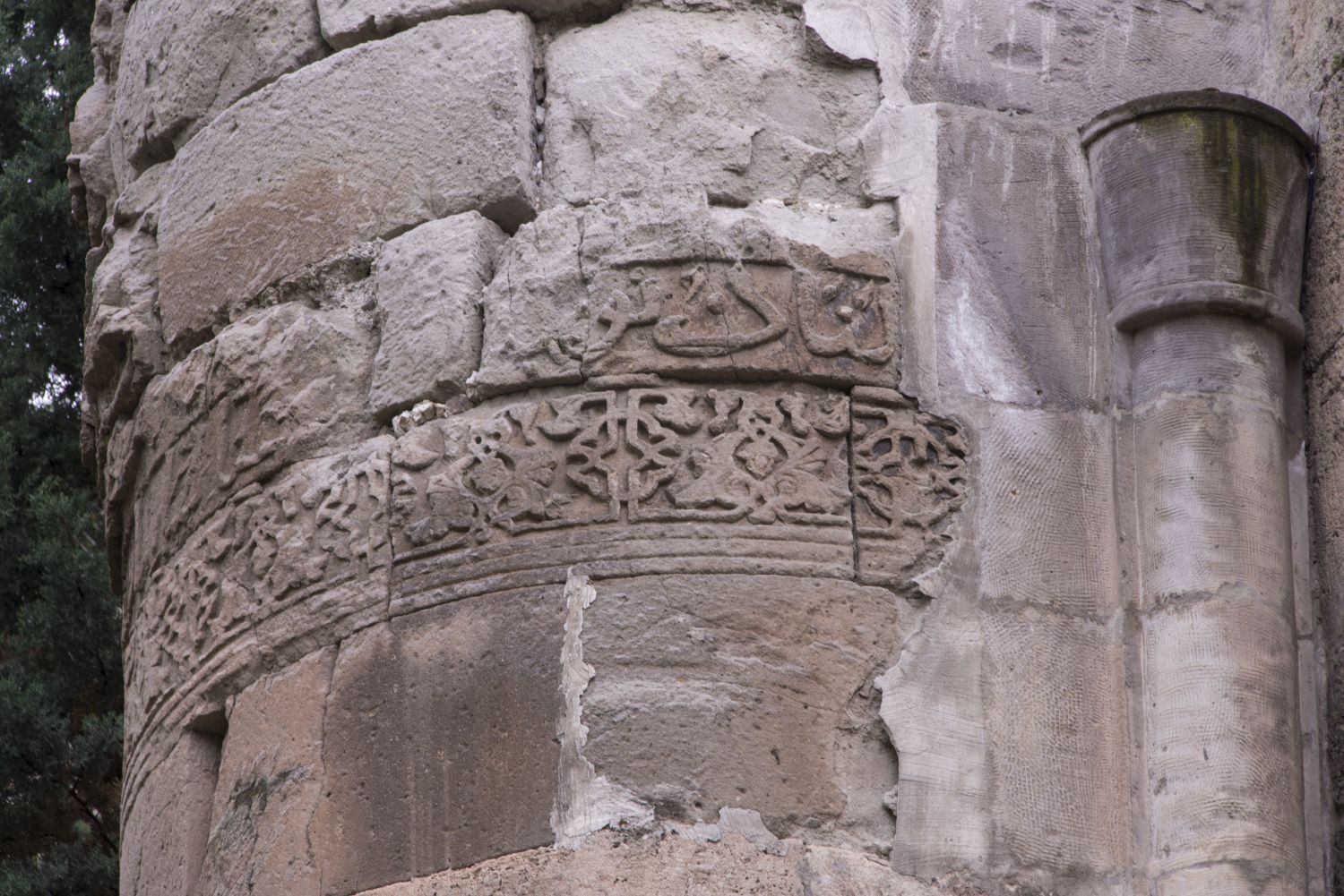 View of frieze bands decorating one of the monumental engaged pillars framing the building's south facade.