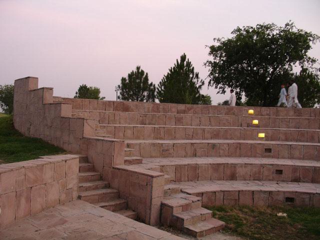 Taxila amphitheatre, tucked in between sloping land, is often a surprise to walkerbys