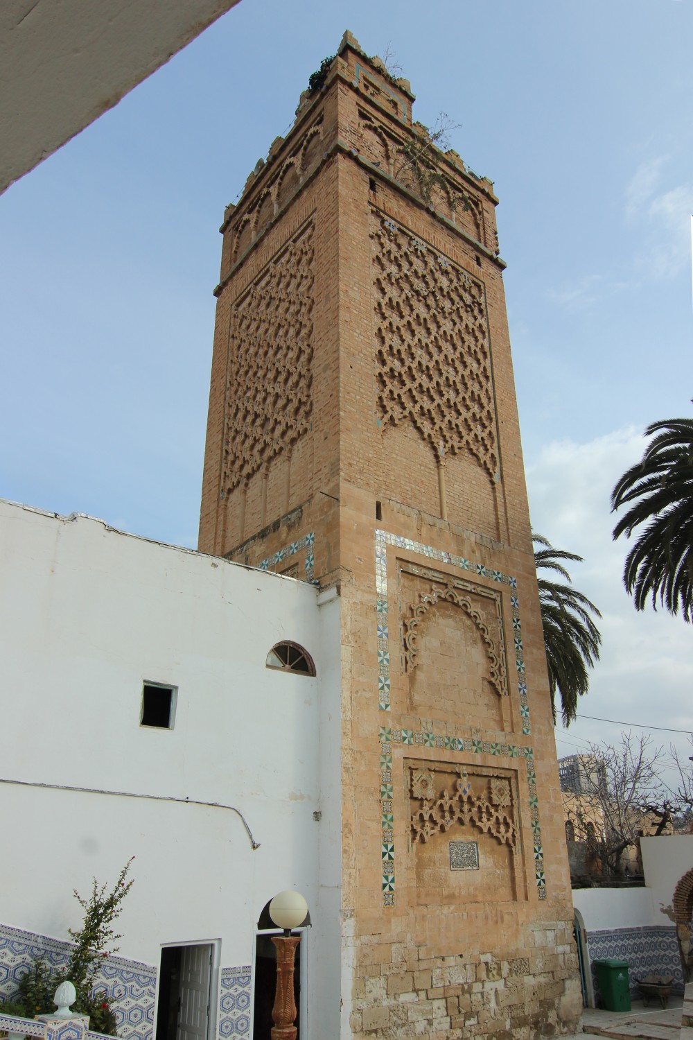Full view of the minaret from south-west showing diamond patterns, lambrequin and lobed arches