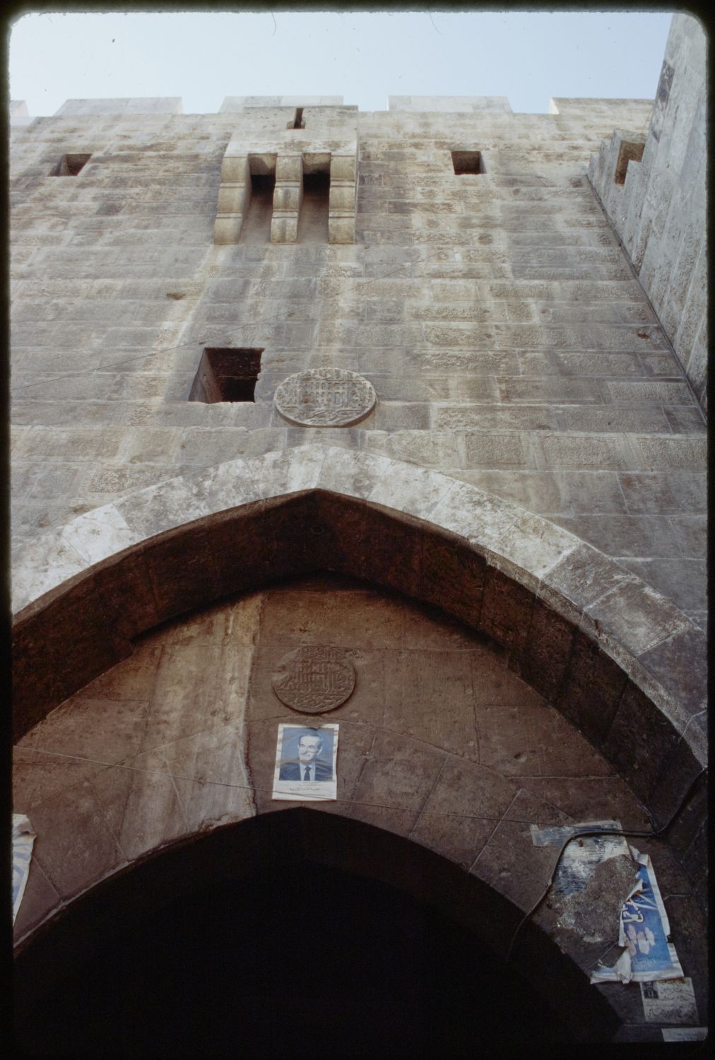 Bab al-Hadid - View of arched entryway and defensive windows above.