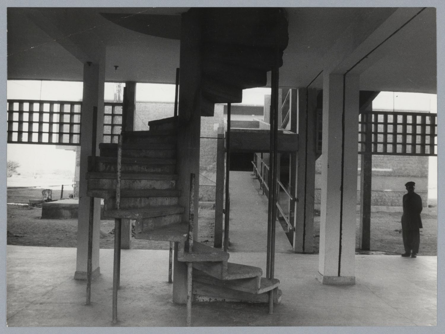 <p>Botany Department: view of building for meeting rooms and classrooms taken during construction. A spiral staircase leading to the second floor is visible in foreground, and a covered ramp leading to a neighboring building is visible behind.</p>
