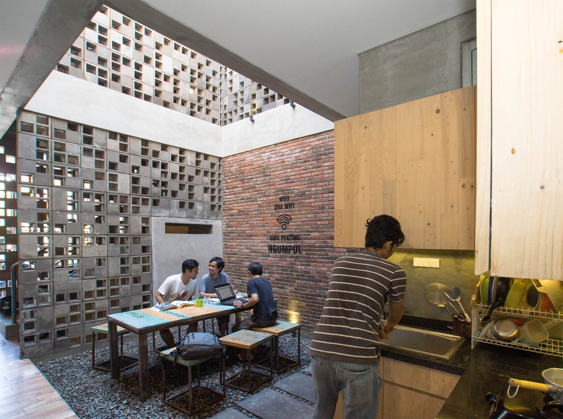 <p>The design borrows two principles from Indonesian architecture. First, communal spaces - here one among the first-floor bedrooms, the other on the roof - to encourage community spirit.&nbsp;Second, rich wall surfaces: here pierced concrete panels inspired by gedheg (woven bamboo) and gebyog (wood panels).</p>