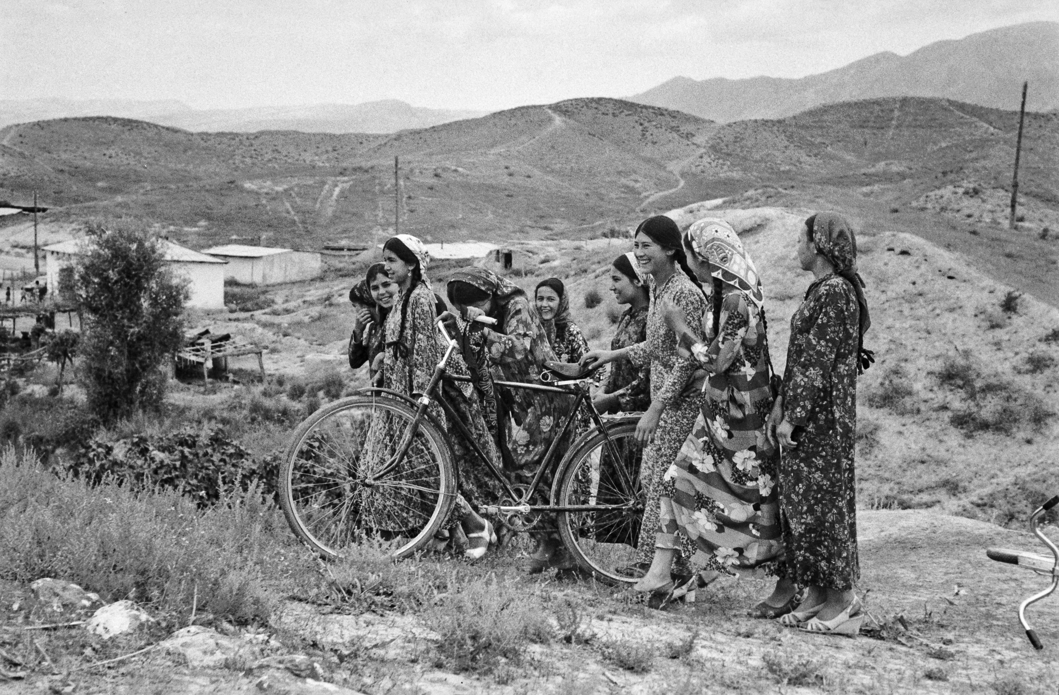 Women with bikes, wearing long dresses (<span style="font-style: italic;">koynek</span>) and head scarves (<span style="font-style: italic;">yaglyk</span>).
