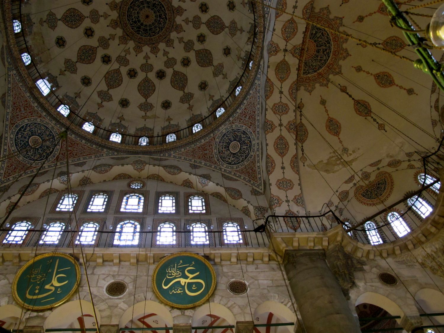 Interior partial view, dome and semi-domes over prayer hall, pendentives, fenestrated tympanum and inscriptions