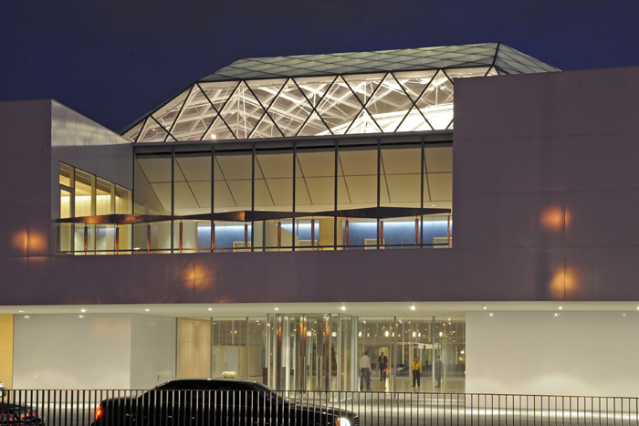 Main entrance and glass roof over the atrium lobby at night