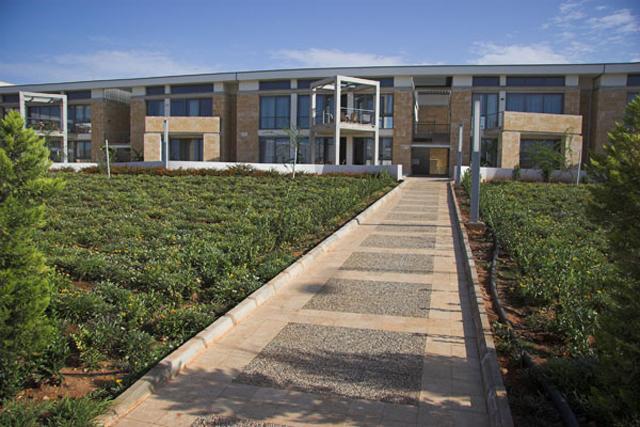 METU North Cyprus Campus Staff Housing - General view from apartment blocks with pedestrian walkway