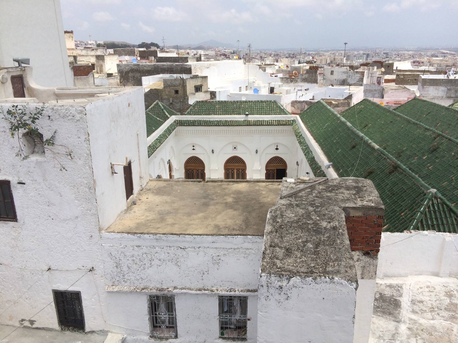 View down to the sahn from the rooftop of Dar Ben Jelloun, wood screens on the arcades visible