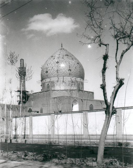 Exterior view looking northeast from Chahar Bagh Avenue showing sanctuary dome and minaret from rear