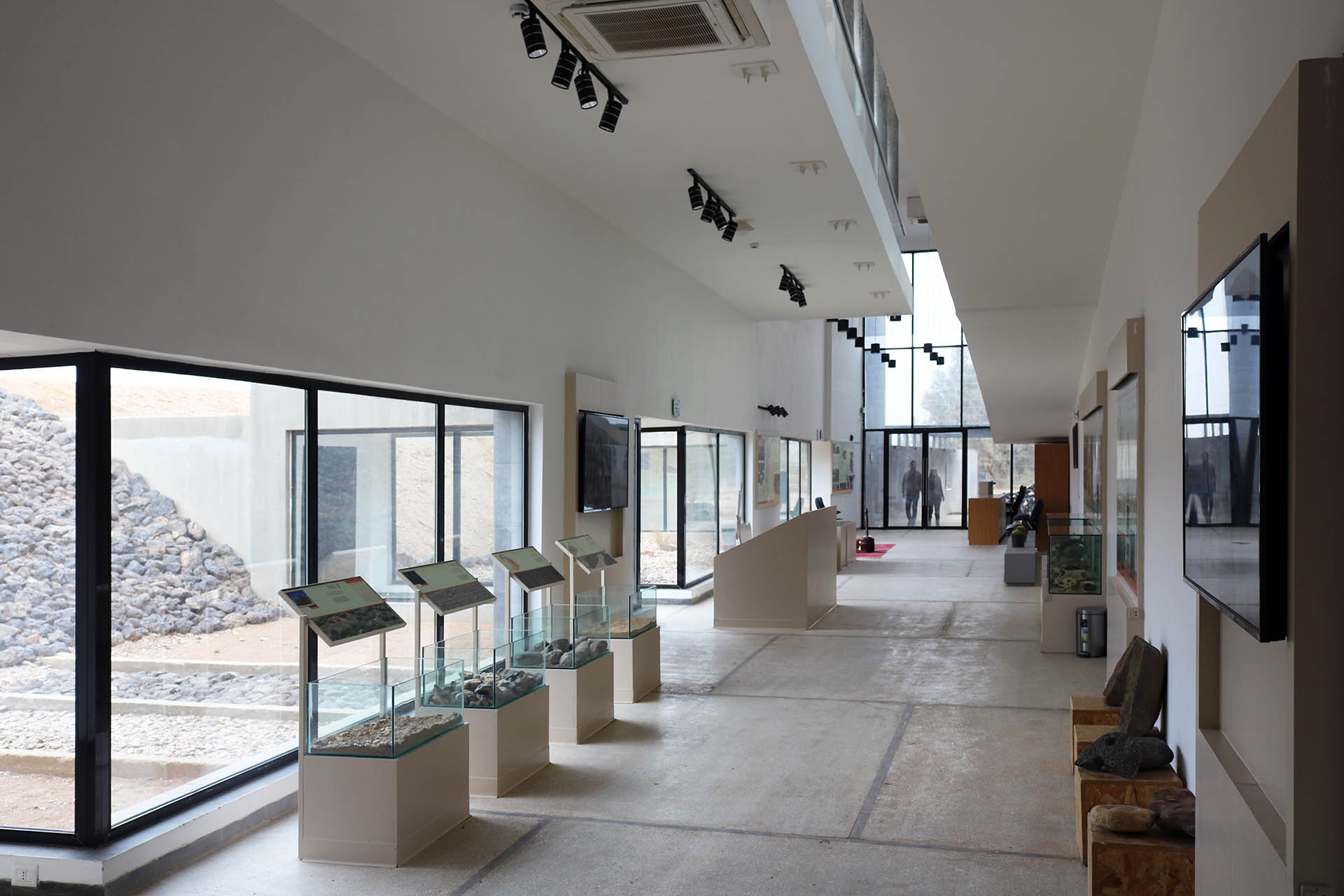 <p>Interior of visitor center showing furniture holding interpretation materials</p>