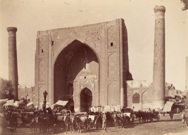Exterior view from Registan Square showing the entrance portal with flanking minarets