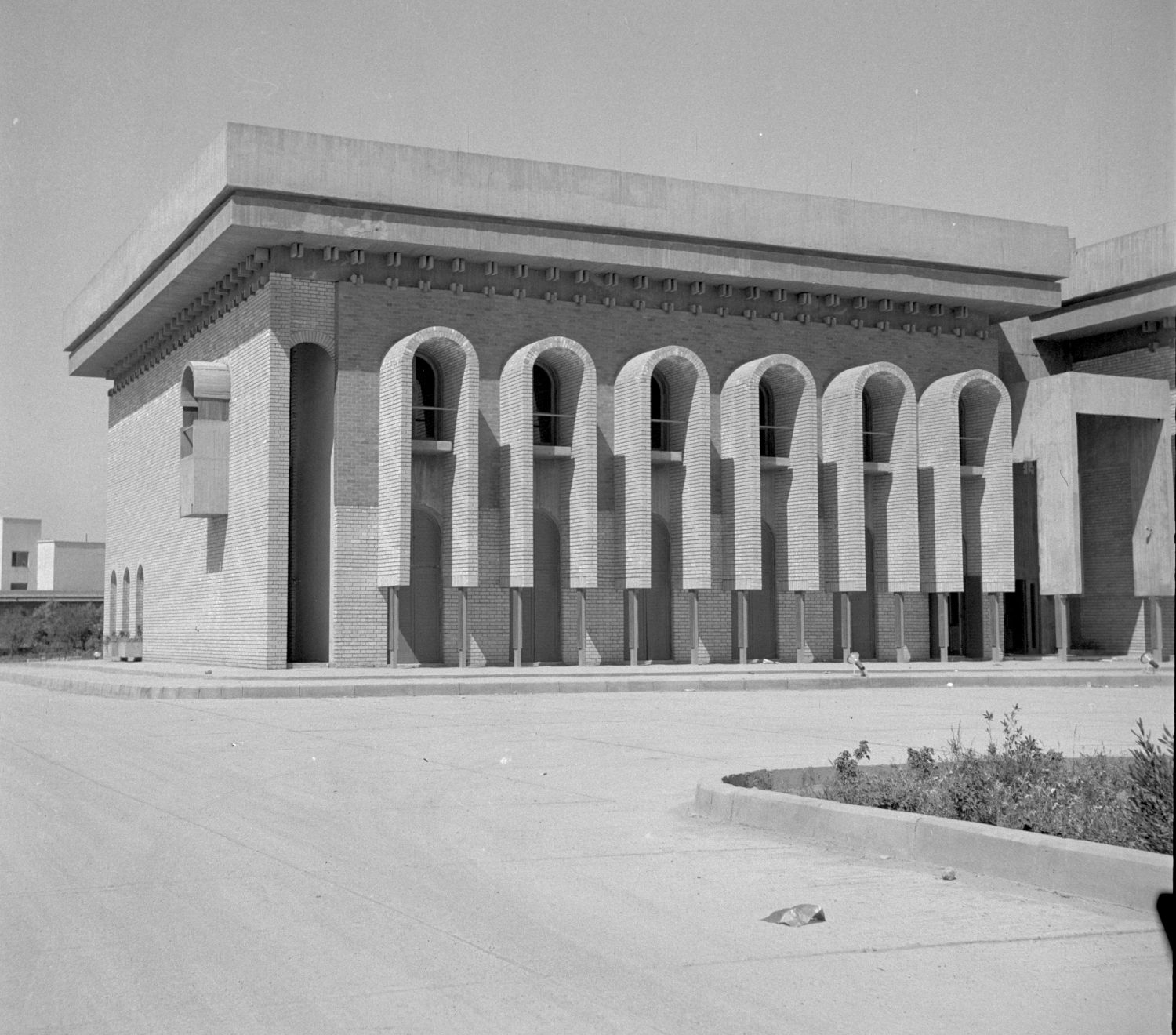 Iraqi Scientific Academy Building - <p>Exterior view, northeast facade, south side, with windows framed by archways.</p>