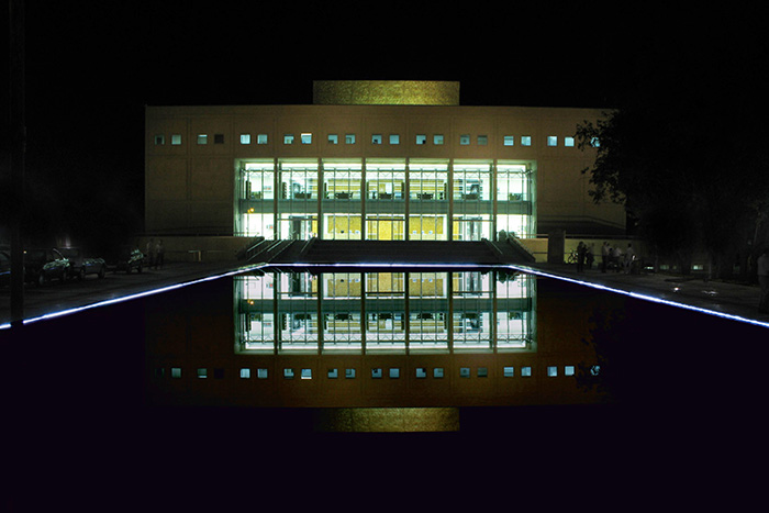 Library main facade, northwest elevation view at night 
