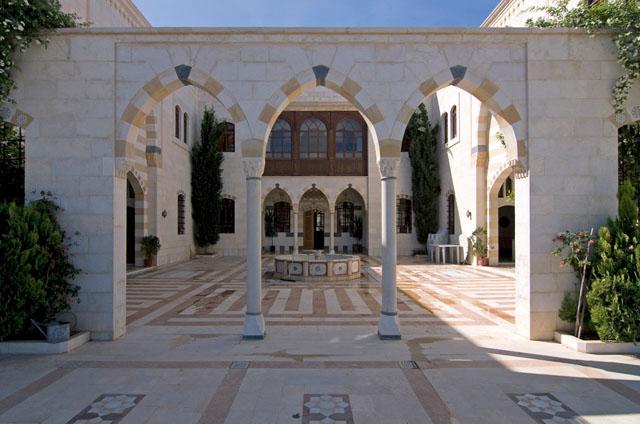 Colonnade overlooking pool, seen from the courtyard (North)