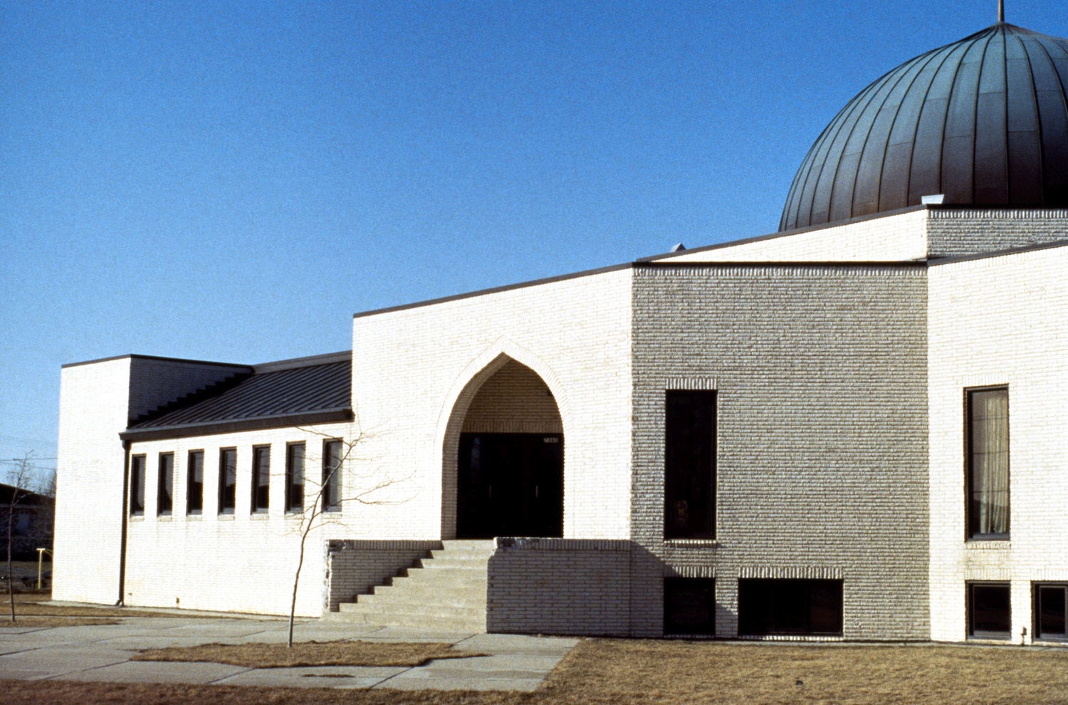 View of south facade, with entrance and partial view of dome; mosque prior to expansion