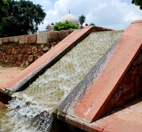 Water flows down a restored, sandstone chadar