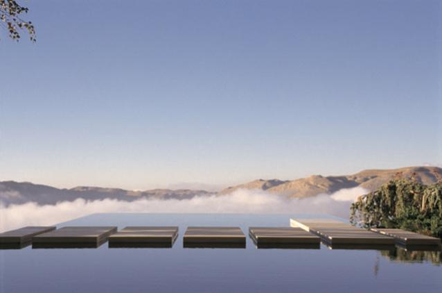 Sky walk, stepping stones floating above mountain ranges
