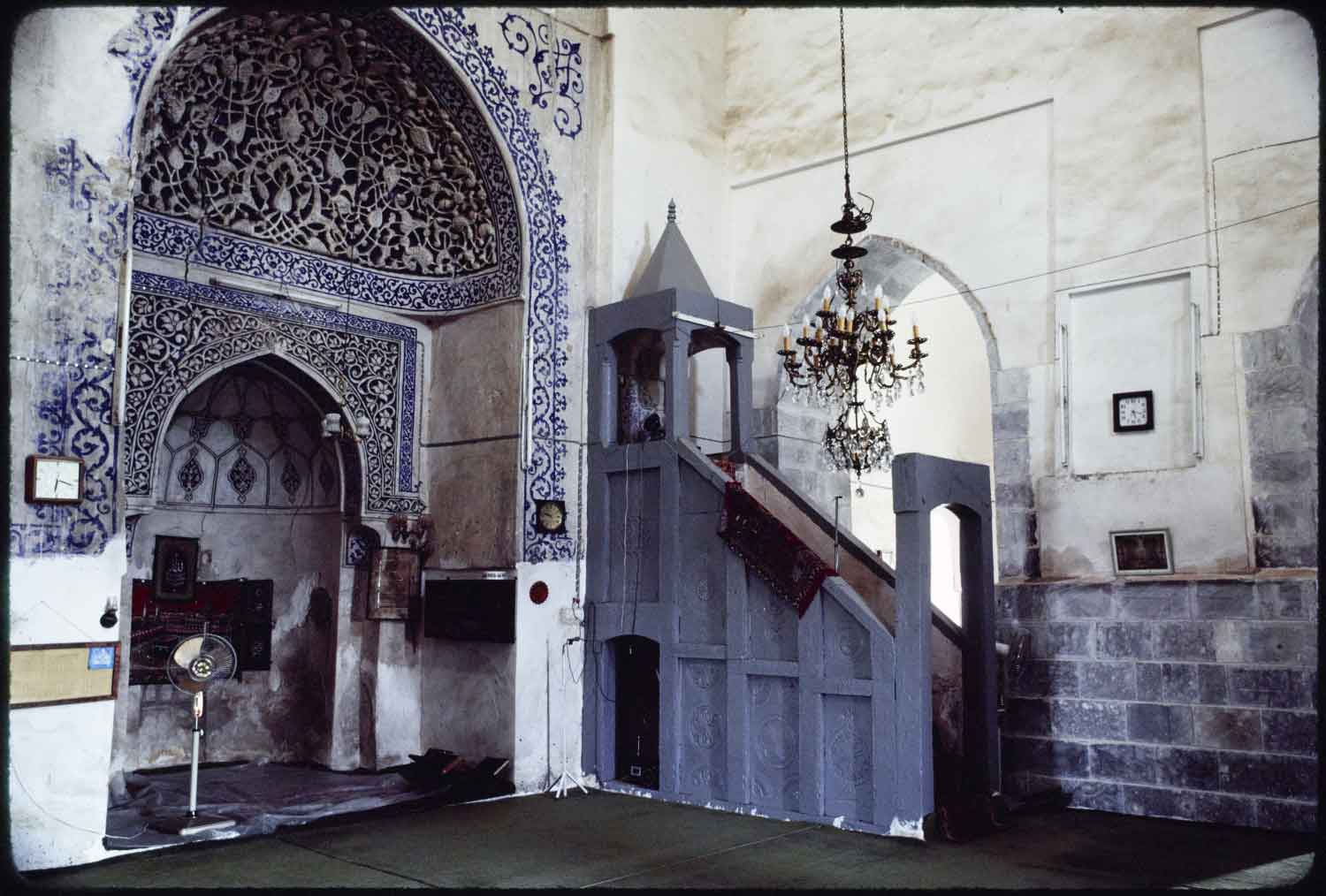 Interior view of prayer hall showing mihrab and minbar.