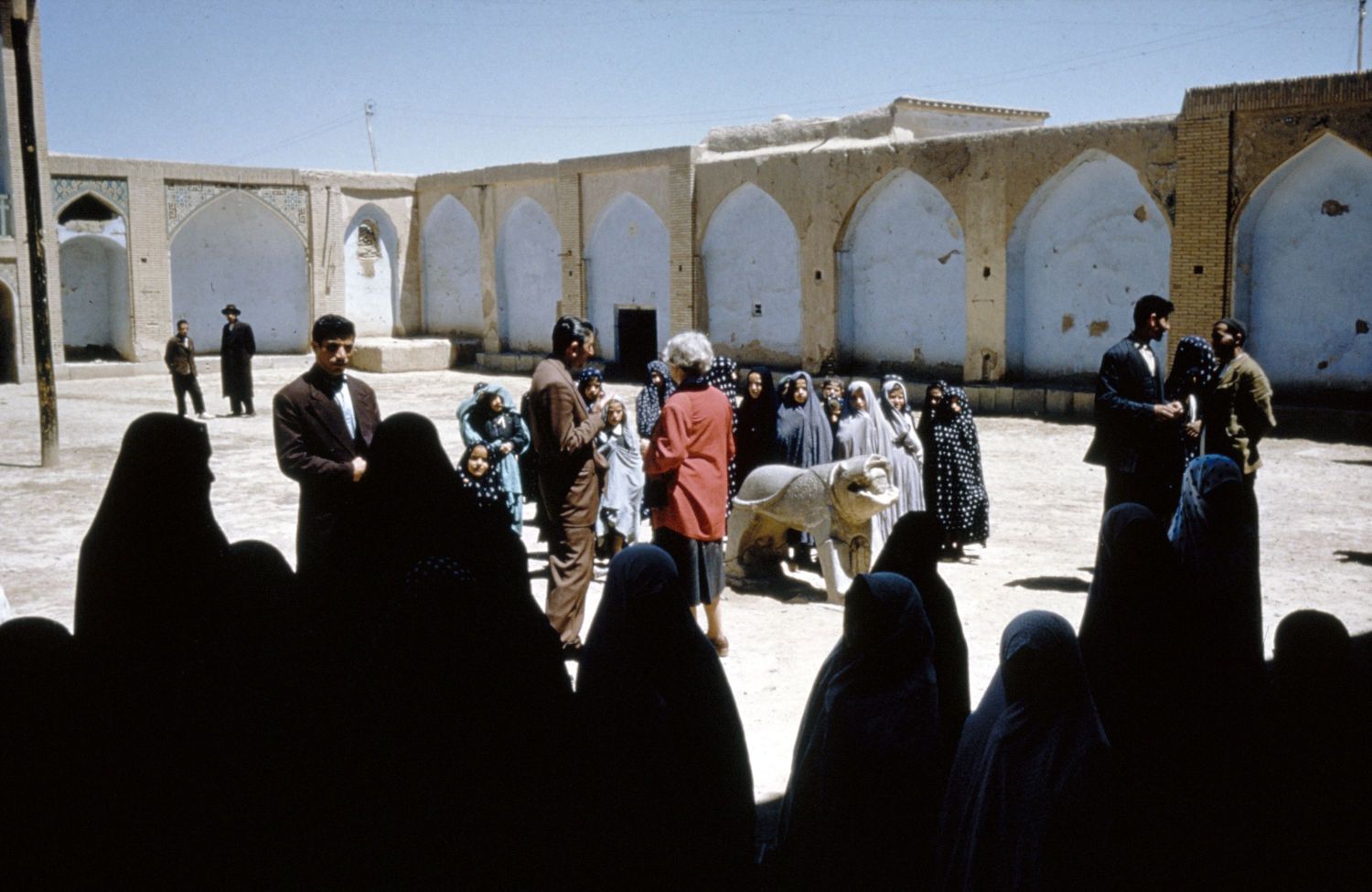 Darb-i Imam - View of visitors in forecourt.