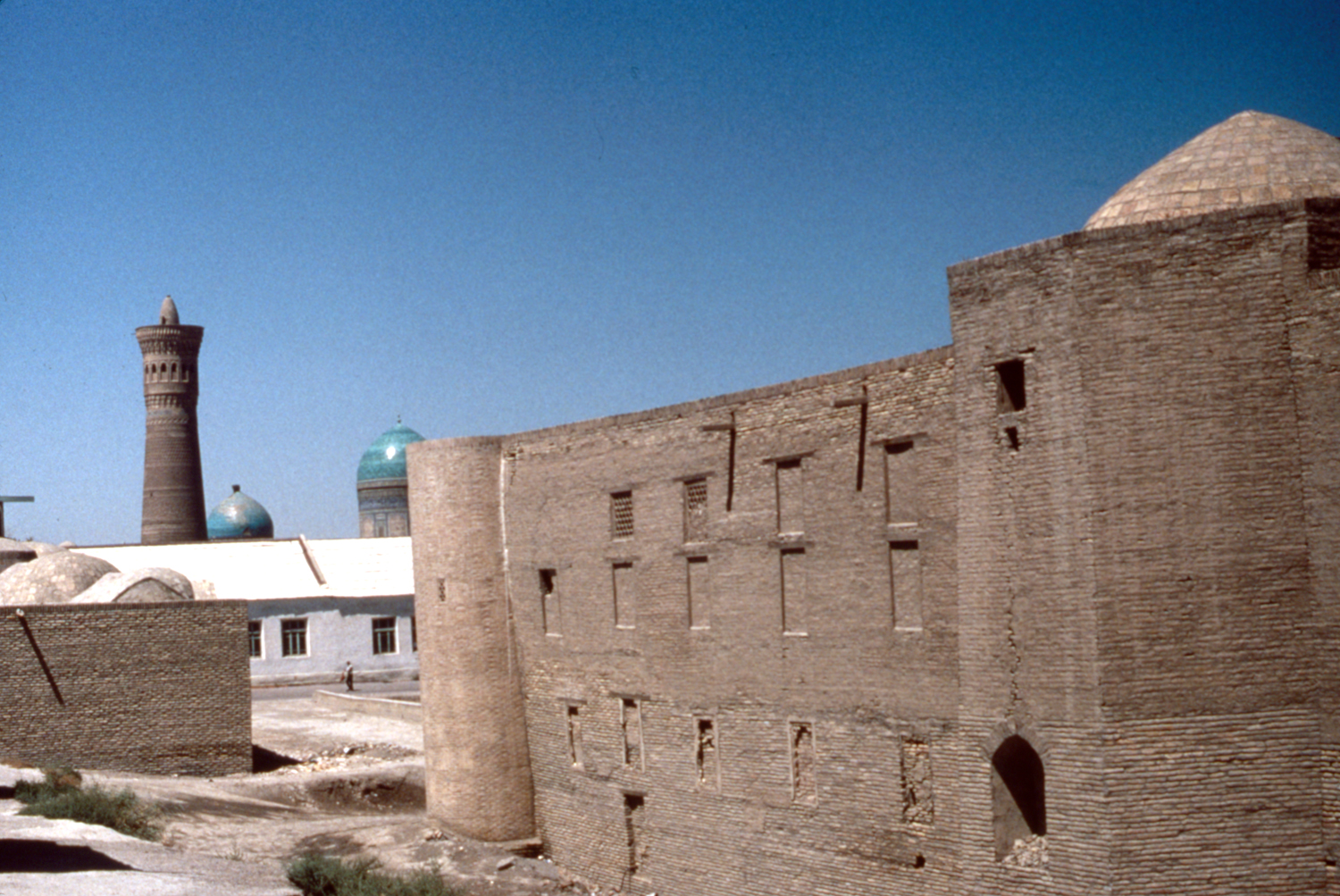 Abdullaxon Timi - Exterior view along side facade, with Kalyan minaret in background