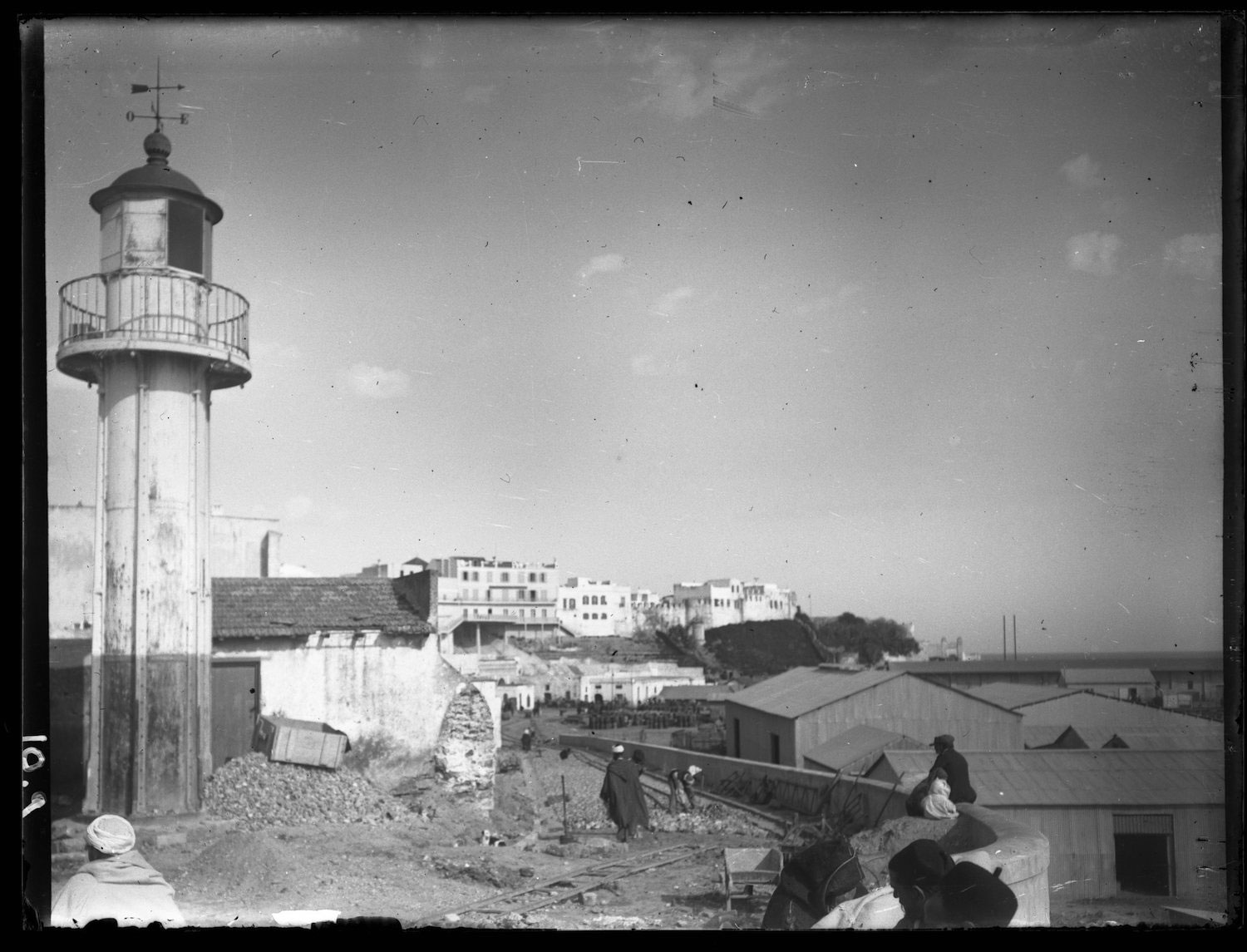 View of a lighthouse by the beach front tracks, viewed toward the Hotel Continental